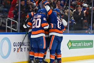 The Islanders celebrate Josh Bailey's goal against the Devils.