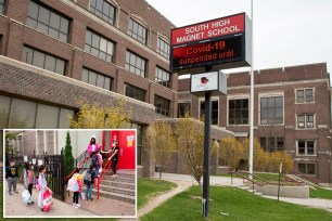 Main: An electronic sign at South High Magnet School in Omaha, Nebraska. Inset: FILE - In this Sept. 29, 2020, file photo, students line up to have their temperature checked before entering PS 179 elementary school in the Kensington neighborhood in the Brooklyn.