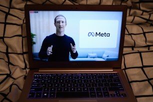 Mark Zuckerberg against a screen with the Meta logo