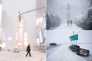 Pedestrians walk through snow and wind in Times Square as a Nor'easter hits the east coast in New York City on January 29, 2022.