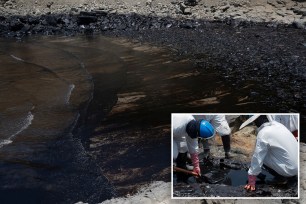 Oil wash ashore at a beach in the Peruvian province of Callao on January 17, 2022, after a spill which occurred during the unloading process of the Italian-flagged tanker "Mare Doricum" at La Pampilla refinery caused by the abnormal waves recorded after the volcanic eruption in Tonga.