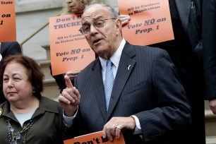 Opponents of casinos in New York, including State Senator Liz Krueger, third from left, and New York State Conservative Party chairman Mike Long, fifth from left, hold a news conference on the steps of City Hall in New York, Thursday, Oct. 31, 2013.