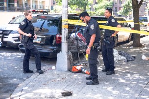 NYPD investigates the scene of a stabbing at the corner of 192nd and Audubon in Manhattan on Sunday afternoon.