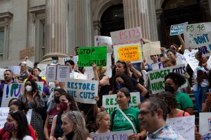 Public school advocates protesting budget cuts at the Department of Education headquarters on June 18, 2022.