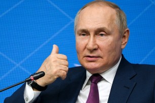 Russian President Vladimir Putin gestures as he speaks during a youth forum in Moscow, Russia, Wednesday, July 20, 2022.