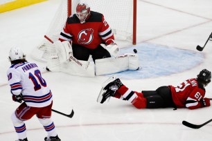 Artemi Panarin (No. 10) scores a goal on Mackenzie Blackwood during the Rangers' 2-1 preseason win over the Devils.