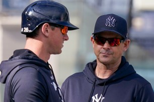 DJ LeMahieu talks with Aaron Boone before the Yankees' 5-1 series-clinching win over the Gaurdians.