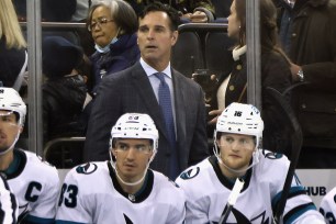 Former Rangers coach David Quinn watches the action during the Sharks' 3-2 overtime victory.