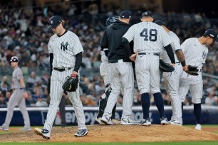 Gerrit Cole walks to the dugout after being taken out of the game during the sixth inning of the Yankees' 5-0 ALCS Game 3 loss to the Astros.