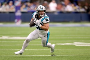 Christian McCaffrey #22 of the Carolina Panthers runs after his catch during a 24-10 loss to the Los Angeles Rams at SoFi Stadium on October 16, 2022 in Inglewood, California.