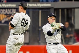 Harrison Bader drops a fly ball hit by Christian Vasquez as he tries to avoid Aaron Judge in the second inning of the Yankees' 5-0 Game 3 ALCS loss to the Astros.