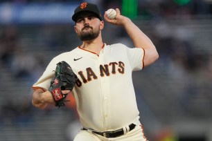 Carlos Rodon #16 of the San Francisco Giants pitches against the Colorado Rockies in the top of the first inning at Oracle Park on September 29, 2022 in San Francisco, California.