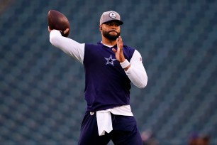 Cowboys quarterback Dak Prescott throws a pass before a game against the Eagles on Oct. 16, 2022.