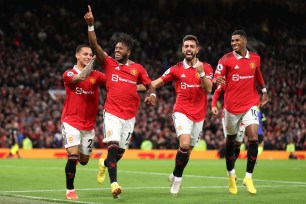 MANCHESTER, ENGLAND - OCTOBER 19: Fred of Manchester United celebrates with team mates Antony, Bruno Fernandes and Marcus Rashford after he scores his sides first goal