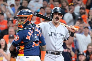 Matt Carpenter #24 of the New York Yankees yells as he is called out on a checked swing to end an ALCS Game 2 loss to Martin Maldonado and the Houston Astros.