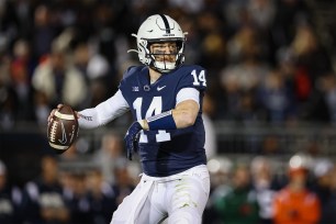 Penn State quarterback Sean Clifford readies for a pass mid-game.