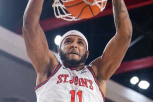 Joel Soriano, who scored 20 points and grabbed 10 rebounds, slams home a dunk during St. John's 77-61 win over Butler.