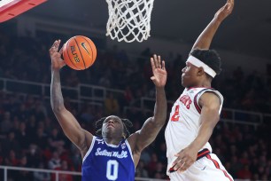 Kadary Richmond, who scored 15 points, goes up for a shot as AJ Storr defends during St. John's 84-72 loss to Seton Hall.