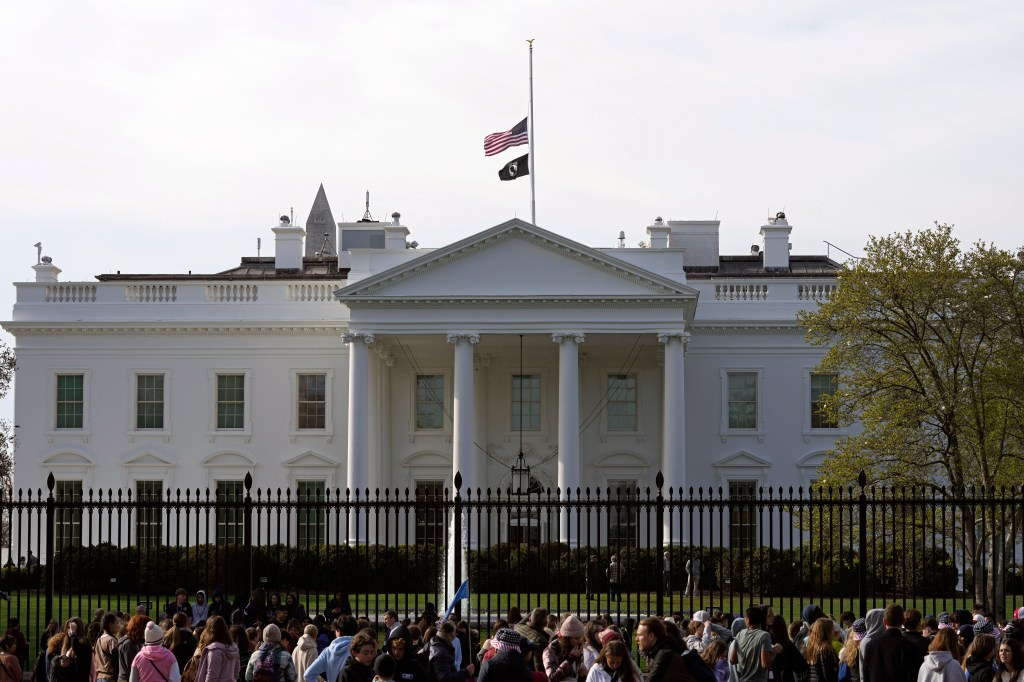 The flag flies at half-staff at the White House in Washington.