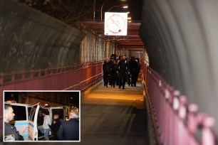 Police escort the four youths who climbed the Brooklyn tower of the Williamsburg Bridge, as they were taken into custody on March 29, 2023.