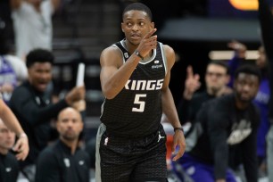 De'Aaron Fox, who scored 38 points, reacts after making a 3-pointer in the third quarter of the Kings' 126-123 Game 1 win over the Warriors.