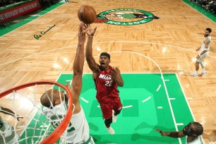 Jimmy Butler, who scored 35 points, shoots a floater during the Heat's 123-116 win over the Celtics in Game 1 of the Eastern Conference finals.