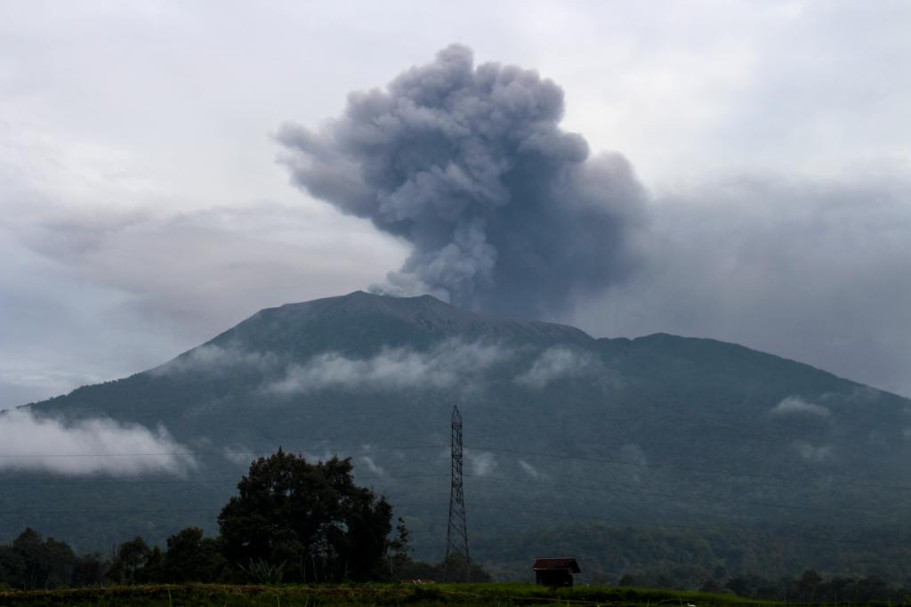 Volcanic ash spews from Mount Marapi during an eruption as seen from Batu Palano village in Agam on December 4, 2023. 