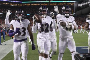 Ravens safety Marcus Williams (32) celebrates with teammates after intercepting a pass against the San Francisco 49ers during the second half.