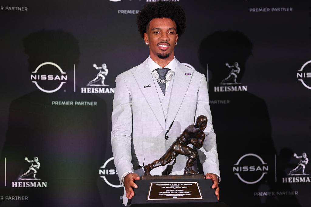 Jayden Daniels poses with the Heisman Trophy after his win in New York City on Dec. 9, 2023.