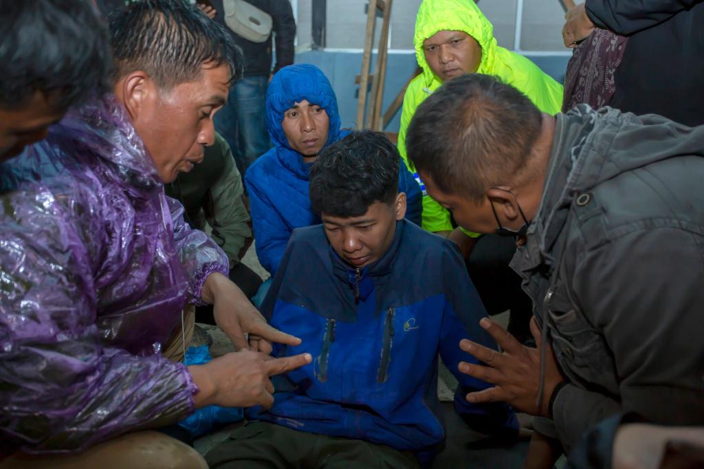 Rescuers transfer the injured in West Sumatra, Indonesia, Dec. 4, 2023.