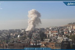 Smoke rises after an Israeli missile strike on Damascus.