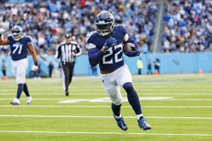 Derrick Henry #22 of the Tennessee Titans runs the ball for a touchdown during the game against the Jacksonville Jaguars.