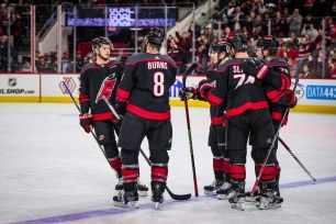 ESPN BET promo code graphic featuring Carolina Hurricanes.