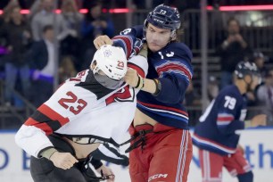 Matt Rempe (right) fights Kurtis MacDermid a few seconds into the Rangers' 4-3 win over the Devils.