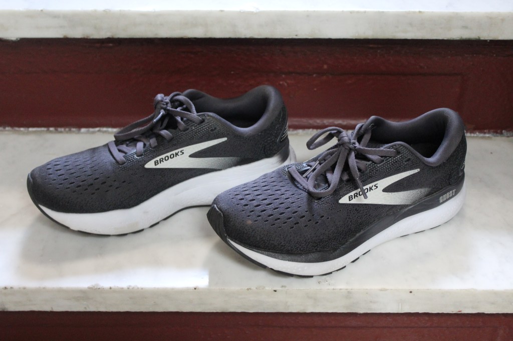 A pair of black Brooks Ghost sneakers