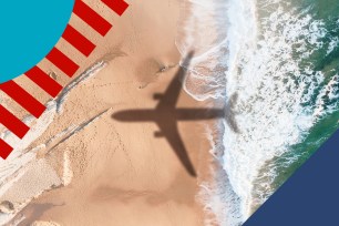 Shadow of an airplane on a beach