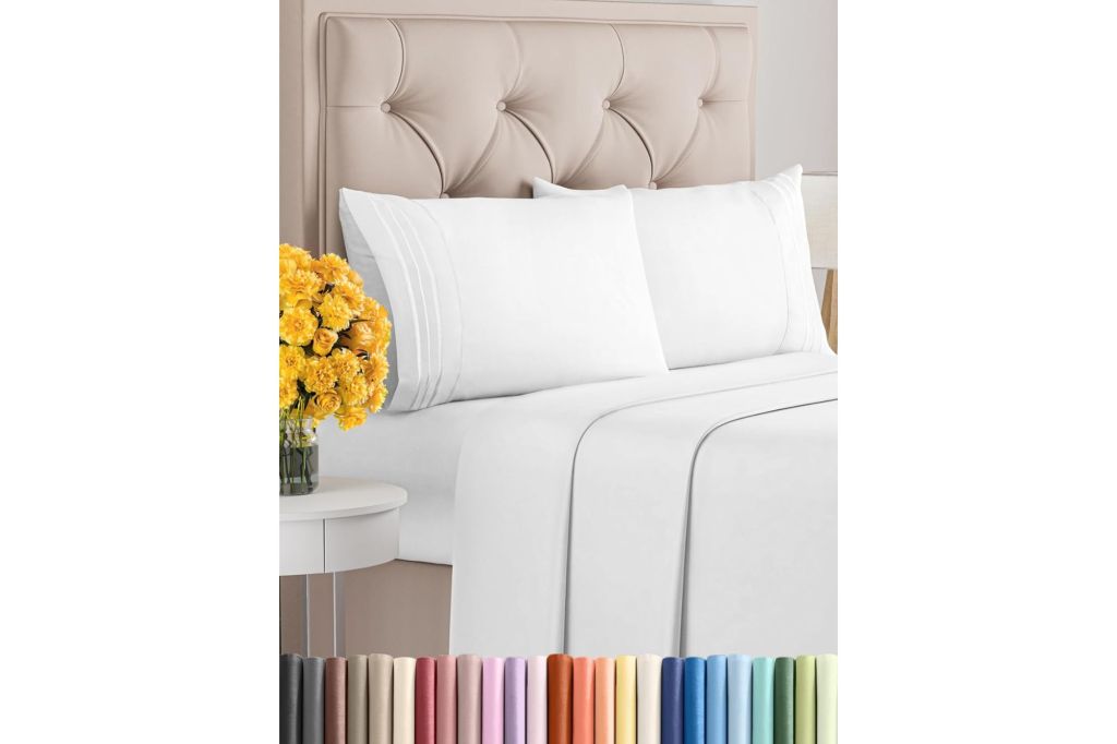 A bed with white linens and a headboard