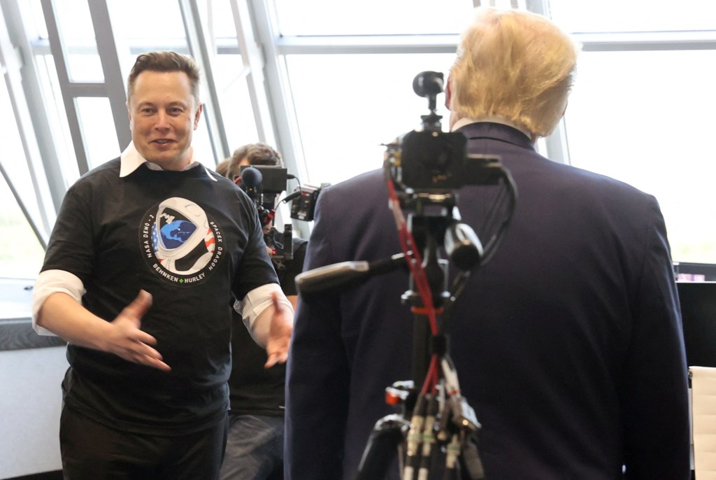 U.S. President Donald Trump and Elon Musk touring Firing Room Four at NASA's Kennedy Space Center after SpaceX Falcon 9 rocket launch, May 30, 2020