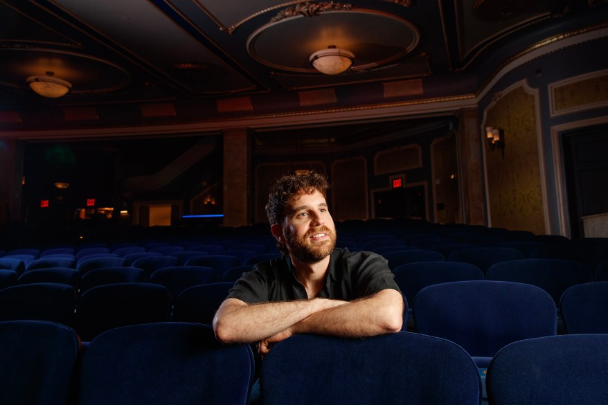 Actor and musician Ben Platt sitting in the audience of the Palace Theatre on Broadway.