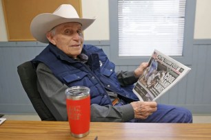 Hall of Fame trainer D. Wayne Lukas shows off Thursday’s cover of The Post’s eight-page Belmont Stakes wrap available in the Saratoga region that profiled the 88-year-old horse-racing legend.