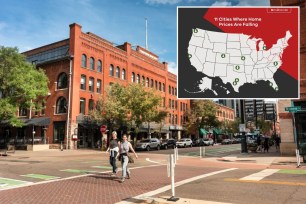 A couple of women walking on a street with a map of the United States