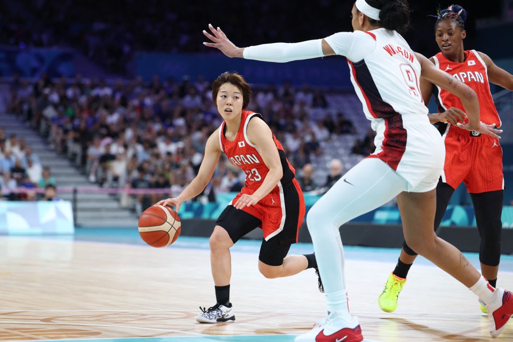 Japan's #23 Mai Yamamoto challenges USA's #09 A'ja Wilson in the women's preliminary round group C basketball match between USA and Japan during the Paris 2024 Olympic Games at the Pierre-Mauroy stadium in Villeneuve-d'Ascq, northern France, on July 29, 2024. 