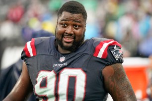 Patriots defensive tackle Christian Barmore, who was diagnosed with blood clots over the weekend, stands on the sideline during an NFL football game against the New York Jets on Sunday Sept. 24, 2023,