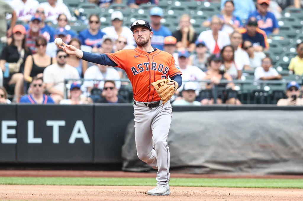 Houston Astros third baseman Alex Bregman (2) throws a runner out at first base in the first inning against the New York Mets at Citi Field.