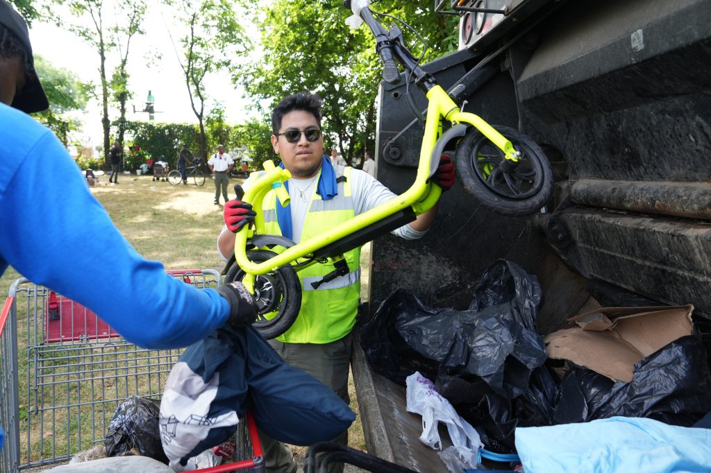 Members of the New York City Police Department and Parks Enforcement Patrol clear a migrant encampment on Randalls Island on Friday.