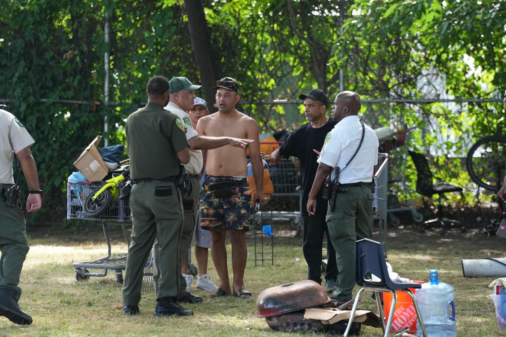 Several migrants could be seen folding up tents, removing laundry from nearby trees and stacking up their cooking pots.