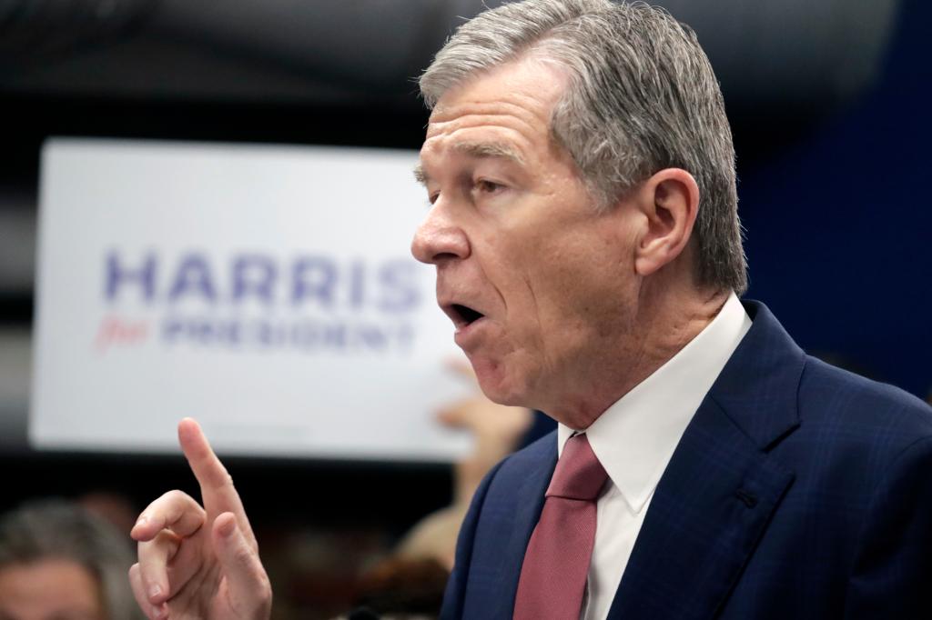 N.C. Governor Roy Cooper speaking at a press conference, being considered as potential running mate for Vice President Kamala Harris in 2024 election