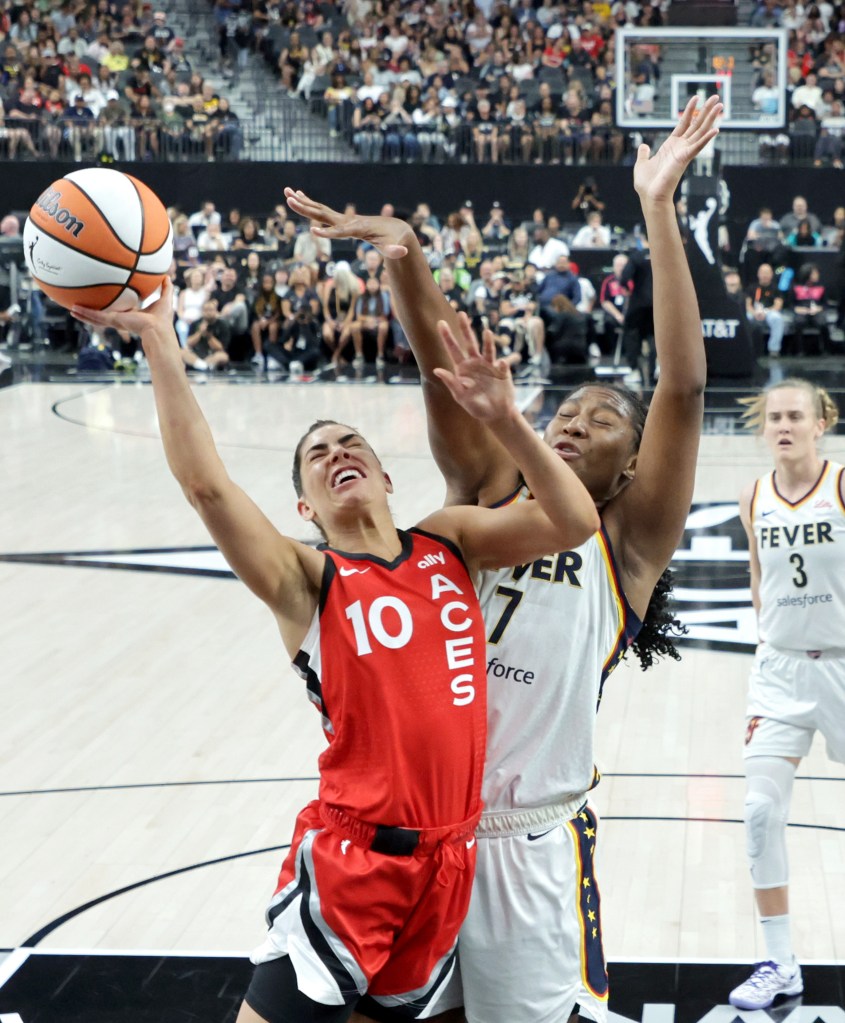 Kelsey Plum #10 of the Las Vegas Aces shoots against Aliyah Boston