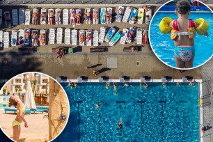 2B57130 People enjoy swimming, jumping and sliding into the public swimming pool at Edirne in northern Turkey on a hot summer day.