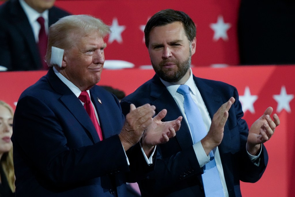 Former President Donald Trump and Senator JD Vance clapping at the Republican National Convention 2024 in Milwaukee